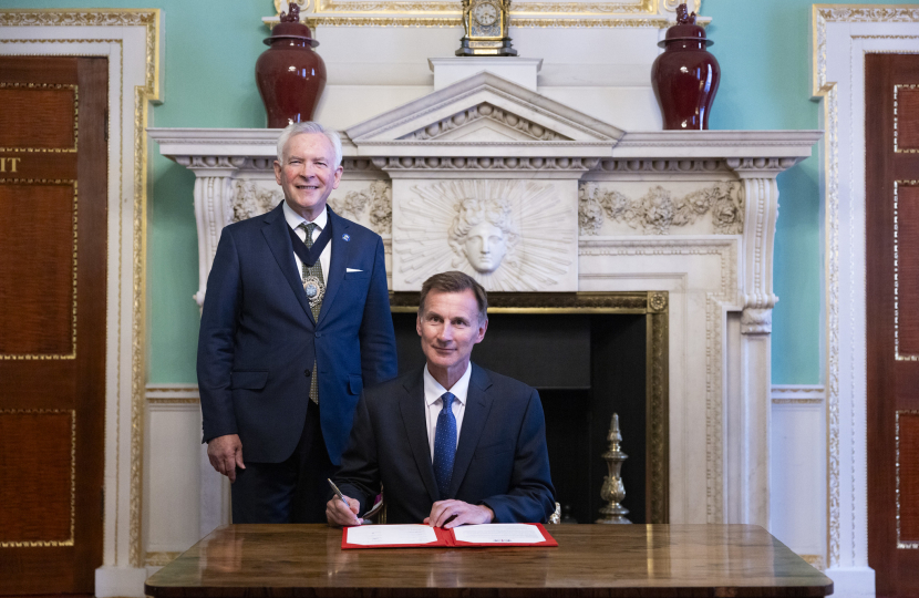 Chancellor Jeremy Hunt, with the Lord Mayor Nicholas Lyons, signs the Mansion House Compact