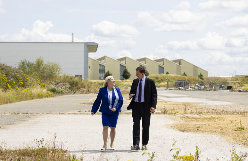 Chancellor Jeremy Hunt walks on land purposed for redevelopment with President of Boeing UK Maria Laine